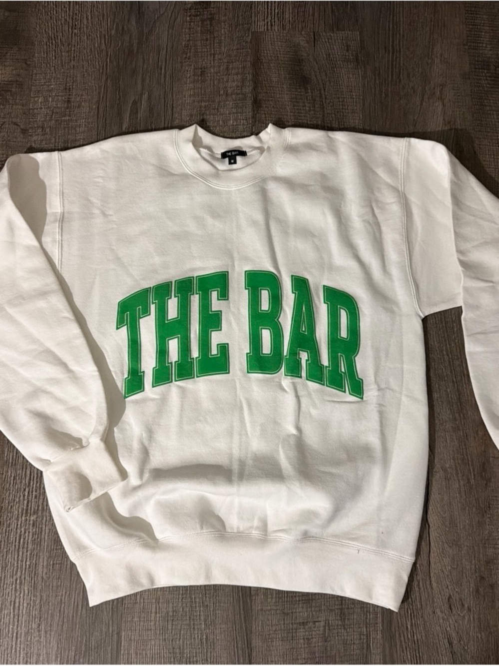 The Bar White Crew Sweatshirt with Green Arch Logo